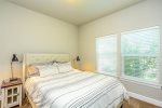 Queen bedroom with lots of natural light and space to unpack and relax